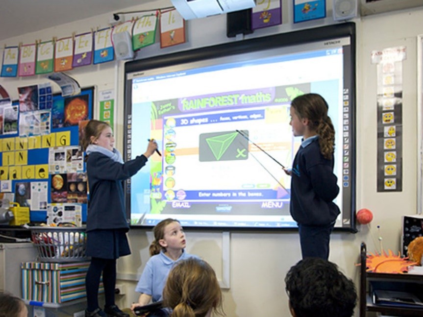 Kids interacting on a Digital Whiteboard