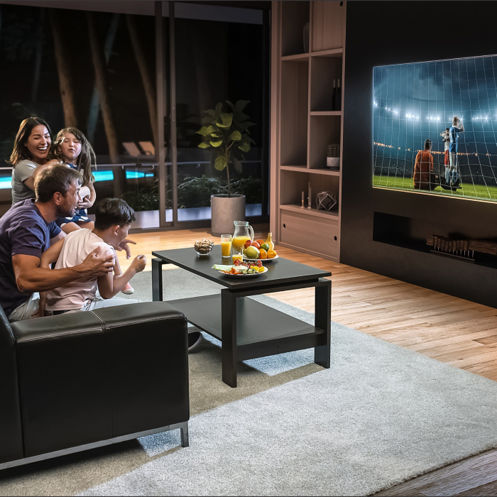 People watching soccer on TV at home